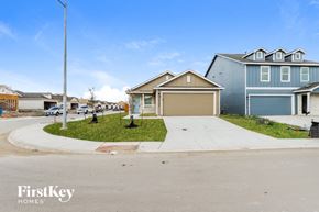 Converse house for rent - A residential area with houses and a clear sky.