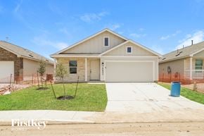 Converse house for rent - A house with a garage and a driveway in front of it.