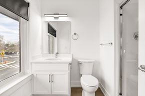 Troy apartment for rent - a bathroom with a sink toilet and a window