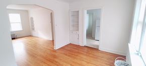 Chicago apartment for rent - an empty living room with white walls and wood floors