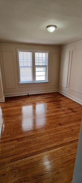 Chicago apartment for rent - the living room of an empty house with wooden floors