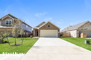 New Caney house for rent - A house with a driveway in front of it.