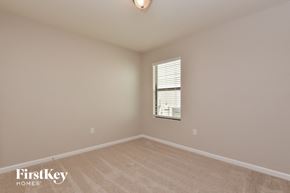 Mims house for rent - a bedroom with a window and a carpeted floor