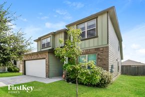 San Antonio house for rent - a green and brown house with a garage