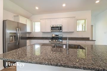 La Marque house for rent - a kitchen with granite counter tops and stainless steel appliances