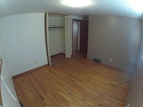 Longmont apartment for rent - A room with wood flooring and a white wall.
