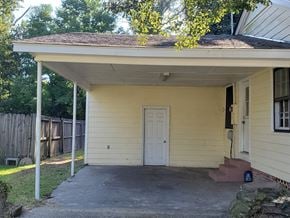 Hattiesburg house for rent - A small house with a white door and a porch.