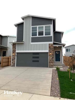 Colorado Springs house for rent - a with a sidewalk in front of it