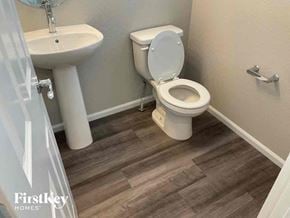 Colorado Springs house for rent - a bathroom with a toilet and a sink
