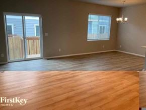 Colorado Springs house for rent - an empty living room with wooden floors and a sliding glass door