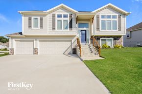 Parkville house for rent - a large house with a driveway in front of it