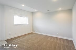 Parkville house for rent - the living room of a new home with white walls and a window