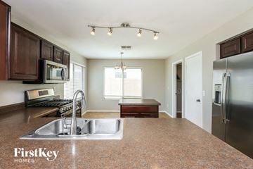 San Tan Valley house for rent - A kitchen with a sink and a refrigerator.