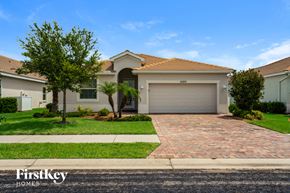 North Port house for rent - a house with a driveway and a garage door