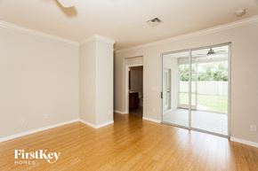 North Port house for rent - a living room with a wood floor and a sliding glass door
