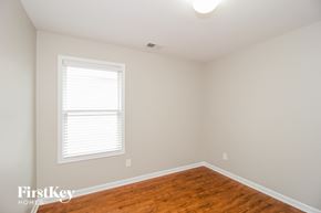 Cartersville house for rent - a bedroom with a hardwood floor and a window