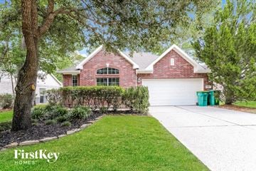 Spring house for rent - a home with a white driveway and a brick house