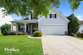 Concord house for rent - a white house with a white garage door