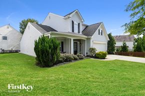 Concord house for rent - a white house with a yard and a green lawn