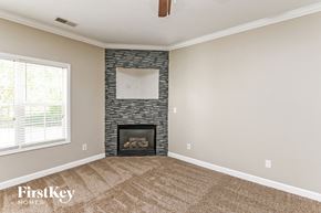 Concord house for rent - a living room with a fireplace and a window