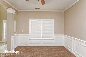 Concord house for rent - a dining room with white walls and a large window