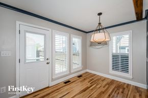 St Charles house for rent - the living room of a home with a wood floor and a white door
