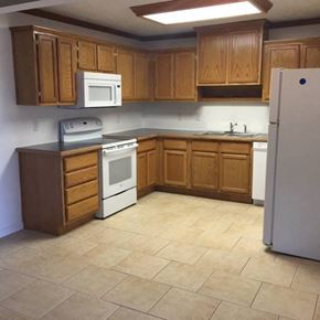 Clinton apartment for rent - an empty kitchen with a stove and a refrigerator