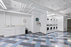 Chicago apartment for rent - A laundry room with a washer and dryer.