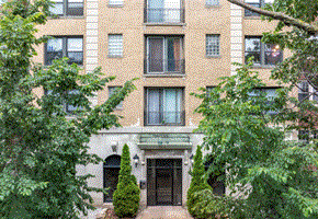 Chicago apartment for rent - A building with a green tree in front of it.