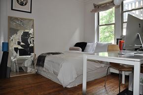 Chicago apartment for rent - a bedroom with a bed and a desk with a computer