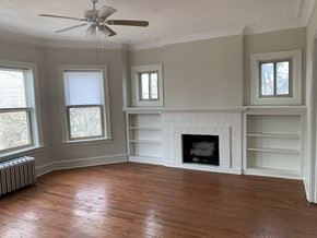 Evanston apartment for rent - a living room with a fireplace and a wooden floor