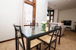 Chicago apartment for rent - a dining room with a glass table and chairs