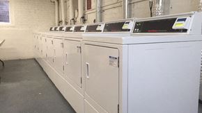 Chicago apartment for rent - a row of white washing machines in a building