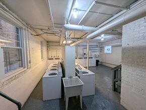Chicago apartment for rent - A laundry room with washers and dryers.