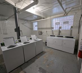 Chicago apartment for rent - A laundry room with washers and dryers.