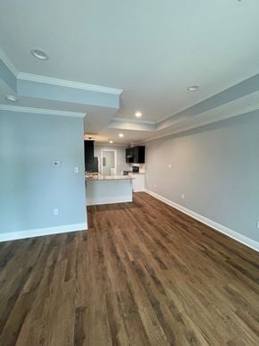 Eunice apartment for rent - the living room and kitchen of a new home with wood flooring