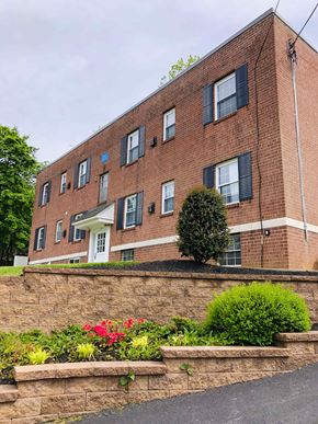Ardmore apartment for rent - A red brick building with a white door and windows.