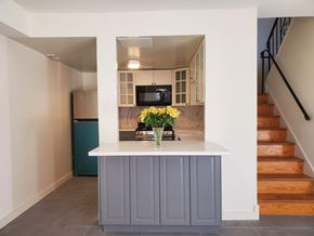 Ardmore apartment for rent - A kitchen with a white counter and a blue trash can.