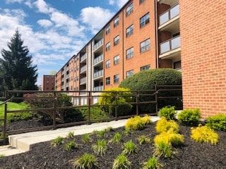 Ardmore apartment for rent - A red brick building with a garden in front.