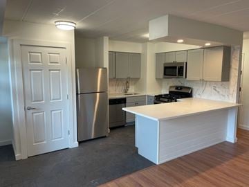 Ardmore apartment for rent - A kitchen with a white island and stainless steel appliances.