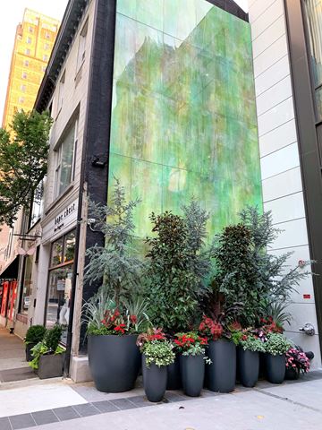 Philadelphia apartment for rent - a row of potted plants in front of a building