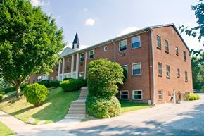 Bala Cynwyd apartment for rent - A red brick building with a steeple on the roof.