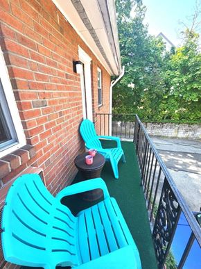 Bala Cynwyd apartment for rent - Two blue chairs on a balcony.