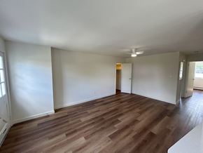 Bala Cynwyd apartment for rent - A room with wooden flooring and white walls.