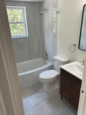 Bala Cynwyd apartment for rent - A white toilet sits next to a white sink in a bathroom.