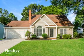 Concord house for rent - A house with a brown roof and a white garage door.
