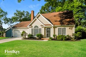 Concord house for rent - A house with a brown roof and a white garage door.