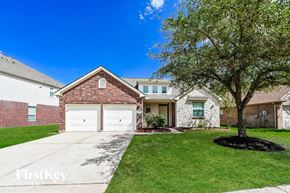 Houston house for rent - a white garage door in front of a brick house
