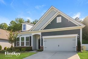 Denver house for rent - a gray house with a white garage door