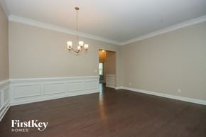 Denver house for rent - an empty living room with white walls and wood floors